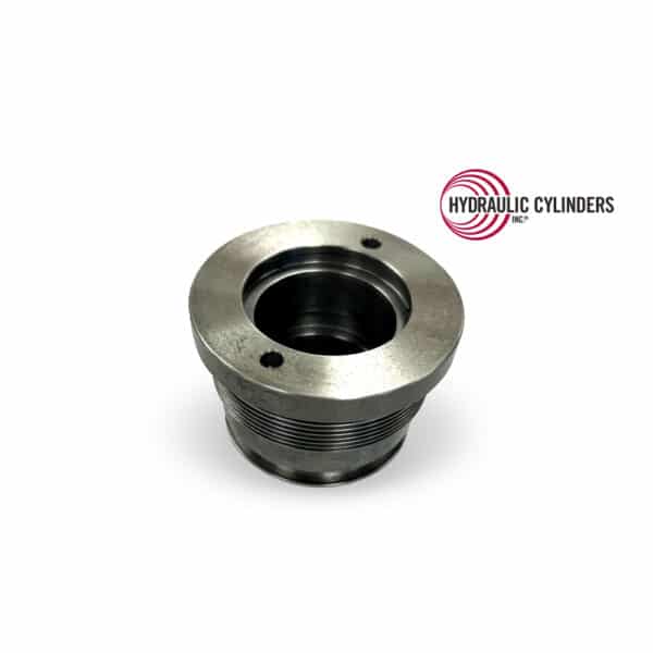 Replacement ductile iron hydraulic cylinder head for Bobcat cylinders. Direct replacement PN 7391278 for E32–E40 excavators and S62–S66 / T62–T66 loaders. Replacement ductile iron hydraulic cylinder head for Bobcat, PN 7391278, fits E32–E40 excavators and S/T series loaders