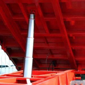 hydraulic cylinder holding up red platform