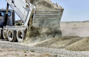 Car unloading material outside