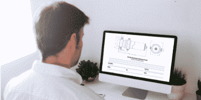 man looking at diagrams on computer