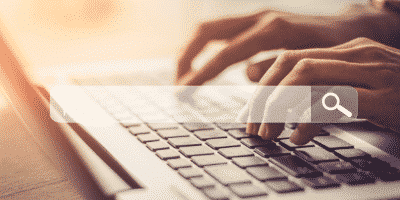 hands typing on keyboard