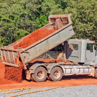 Tip truck dumping dirt