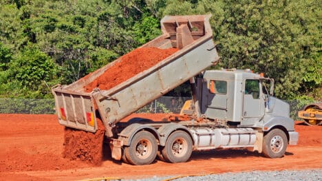 Tip truck dumping dirt