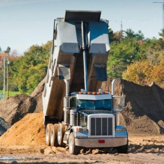 Dump truck dumbing dirt